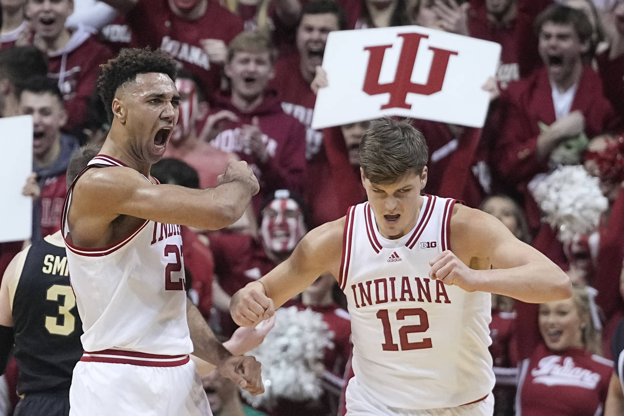 Indiana's Trayce Jackson-Davis, left, reacts with Miller Kopp (12) after Jackson-Davis hit a basket...