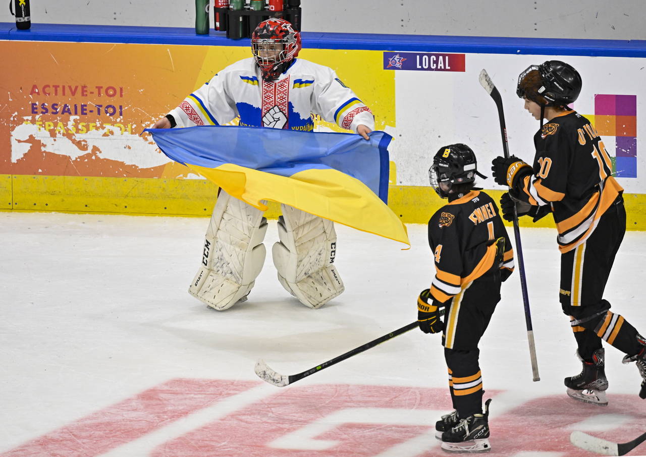 CORRECTS UKRAINE GOALIE NAME TO DMYTRO KORZH, NOT MATVII KULISH - Ukraine peewee team goalie Dmytro...
