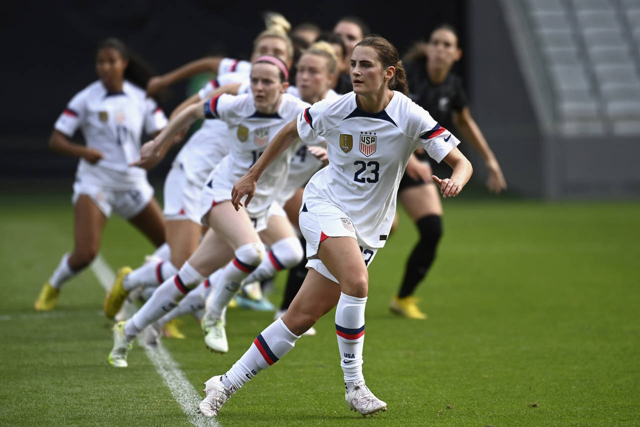 Emily Fox of the U.S., center, leads a string of teammates against New Zealand during their women's...