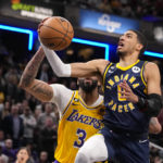 James closes in on scoring record, Lakers rally past Pacers