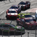 Truex wins NASCAR's sloppy return to Los Angeles Coliseum