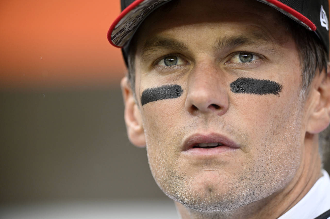 Tampa Bay Buccaneers quarterback Tom Brady stands on the field before an NFL football game against ...