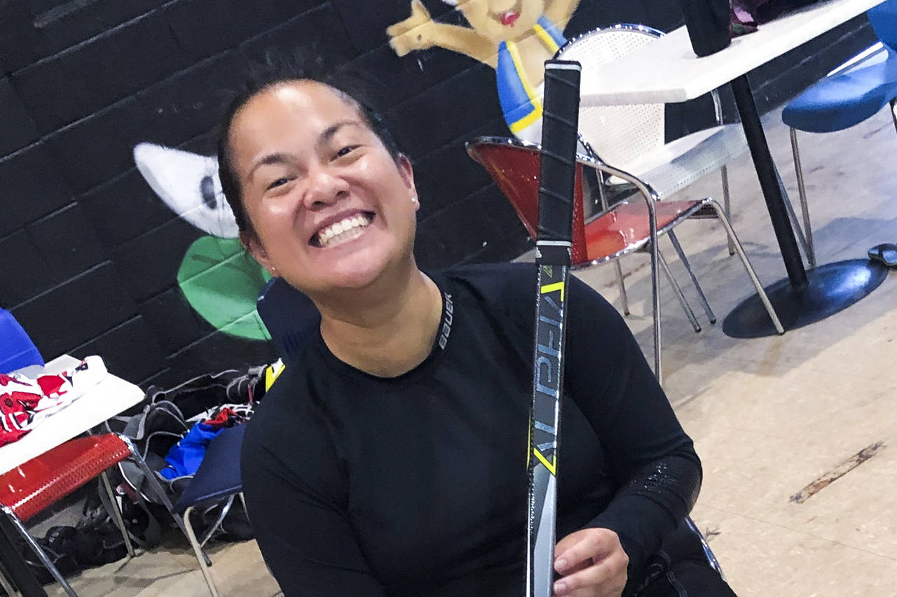 In this photo provided by Zach Roberts, Vivienne Gray poses for a photo prior to a game of inline h...