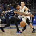 Heat use balanced scoring, rally to beat Magic 106-103 in OT