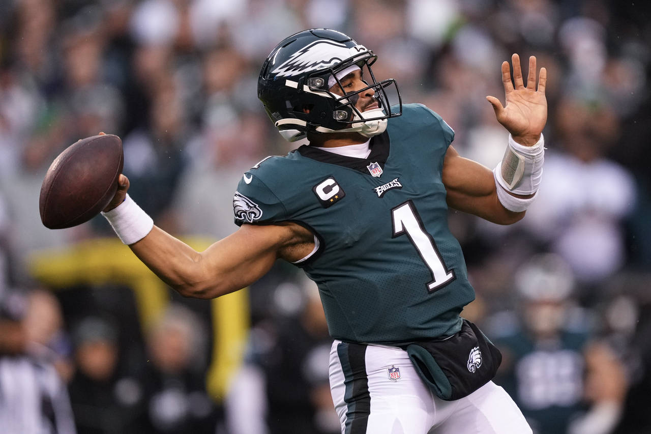 FILE - Philadelphia Eagles quarterback Jalen Hurts passes during the first half of the NFC Champion...