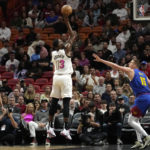 Nikola Jokic scores 27, Nuggets hold off Heat 112-108