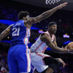 Butler's acrobatic layup, 23 points lead Heat past 76ers