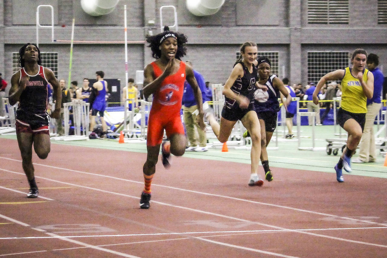 FILE - Bloomfield High School transgender athlete Terry Miller, second from left, wins the final of...