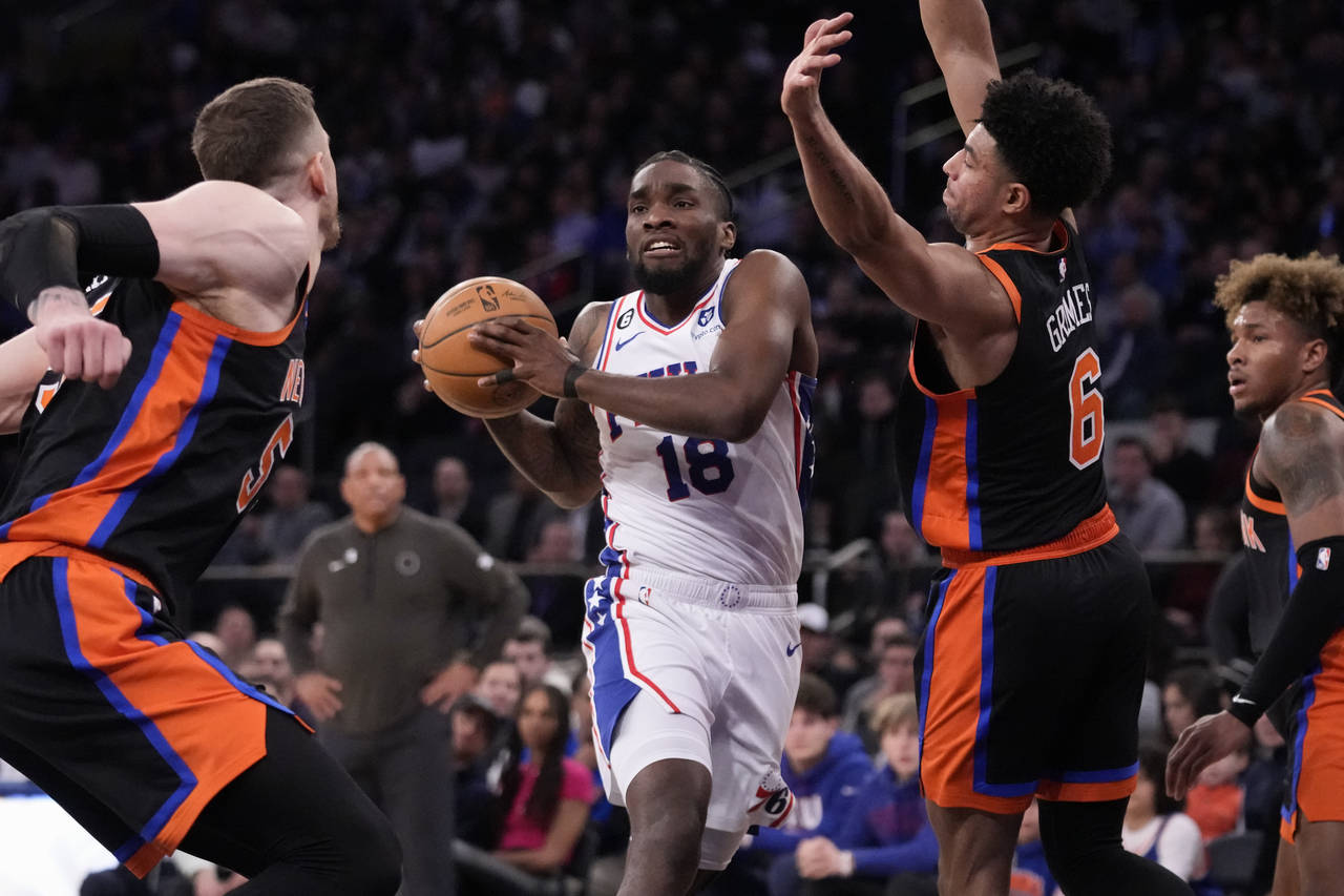 Philadelphia 76ers guard Shake Milton (18) drives against New York Knicks guard Quentin Grimes (6) ...