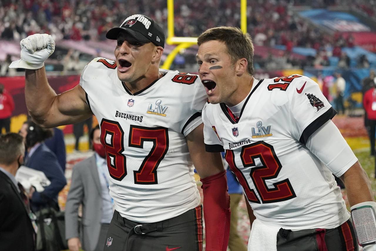 FILE - Tampa Bay Buccaneers tight end Rob Gronkowski, left, and quarterback Tom Brady celebrate aft...
