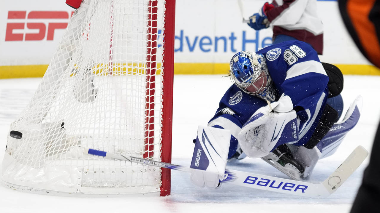 Tampa Bay Lightning goaltender Andrei Vasilevskiy (88) makes a diving save on a shot by the Colorad...