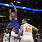 Nikola Jokic scores 27, Nuggets hold off Heat 112-108