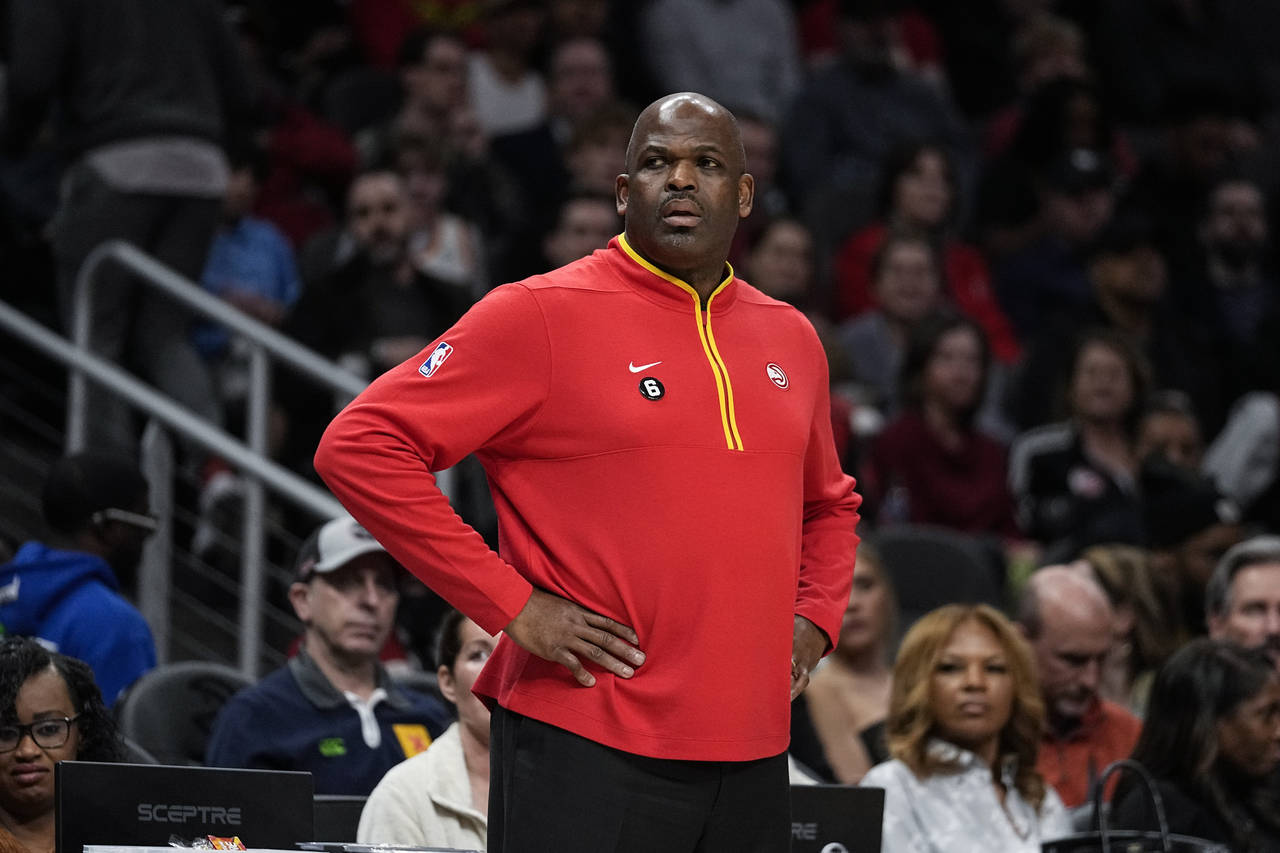 Atlanta Hawks head coach Nate McMillan looks on from the bench during the first half of an NBA bask...