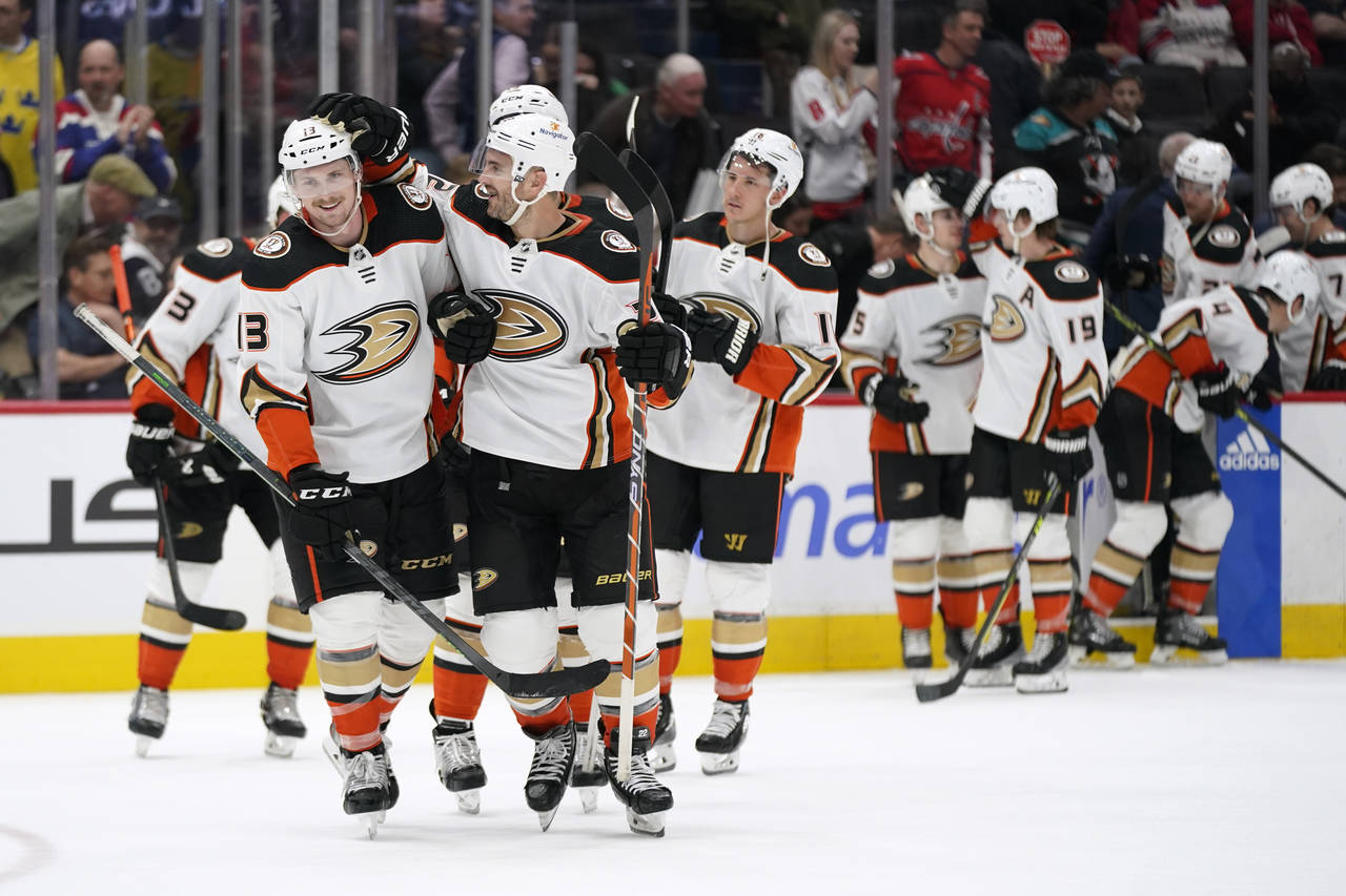 Anaheim Ducks defensemen Simon Benoit, left, and Kevin Shattenkirk celebrate after an NHL hockey ga...