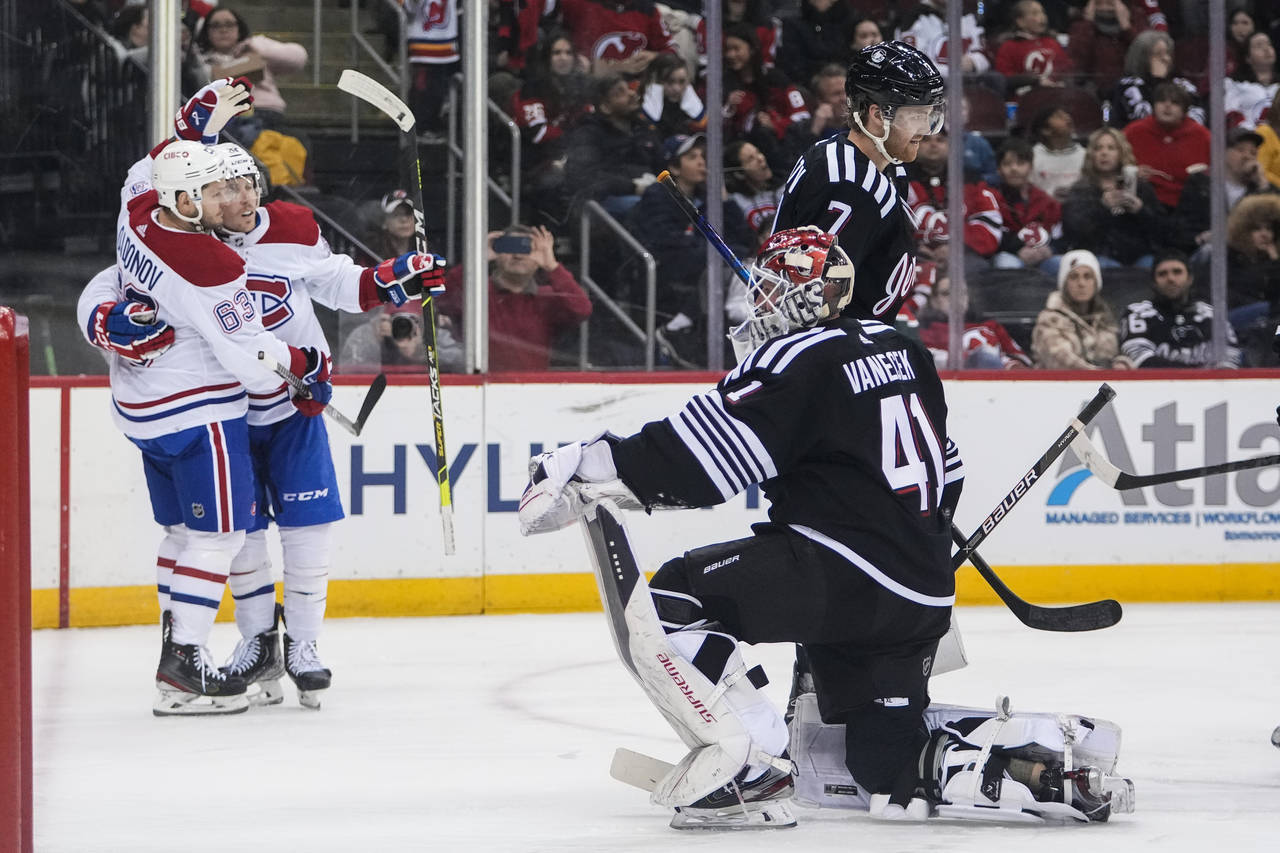 Montreal Canadiens' Evgenii Dadonov (63) celebrates with Rem Pitlick after Pitlick scored a goal du...
