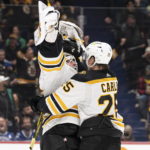 Bruins goaltender Linus Ullmark scores into empty net