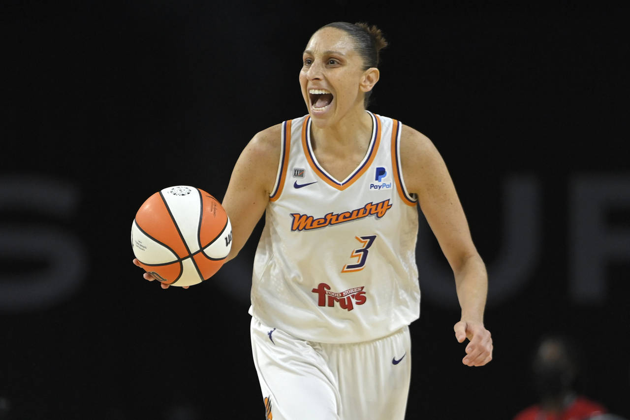 FILE - Phoenix Mercury guard Diana Taurasi (3) calls a play as she brings the ball up court against...