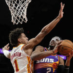 Young scores 36 as Hawks beat short-handed Suns 116-107