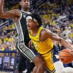 Spartans lose to Michigan in their first game since shooting