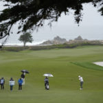 Kitayama leads Pebble Beach as the worst of the wind looms