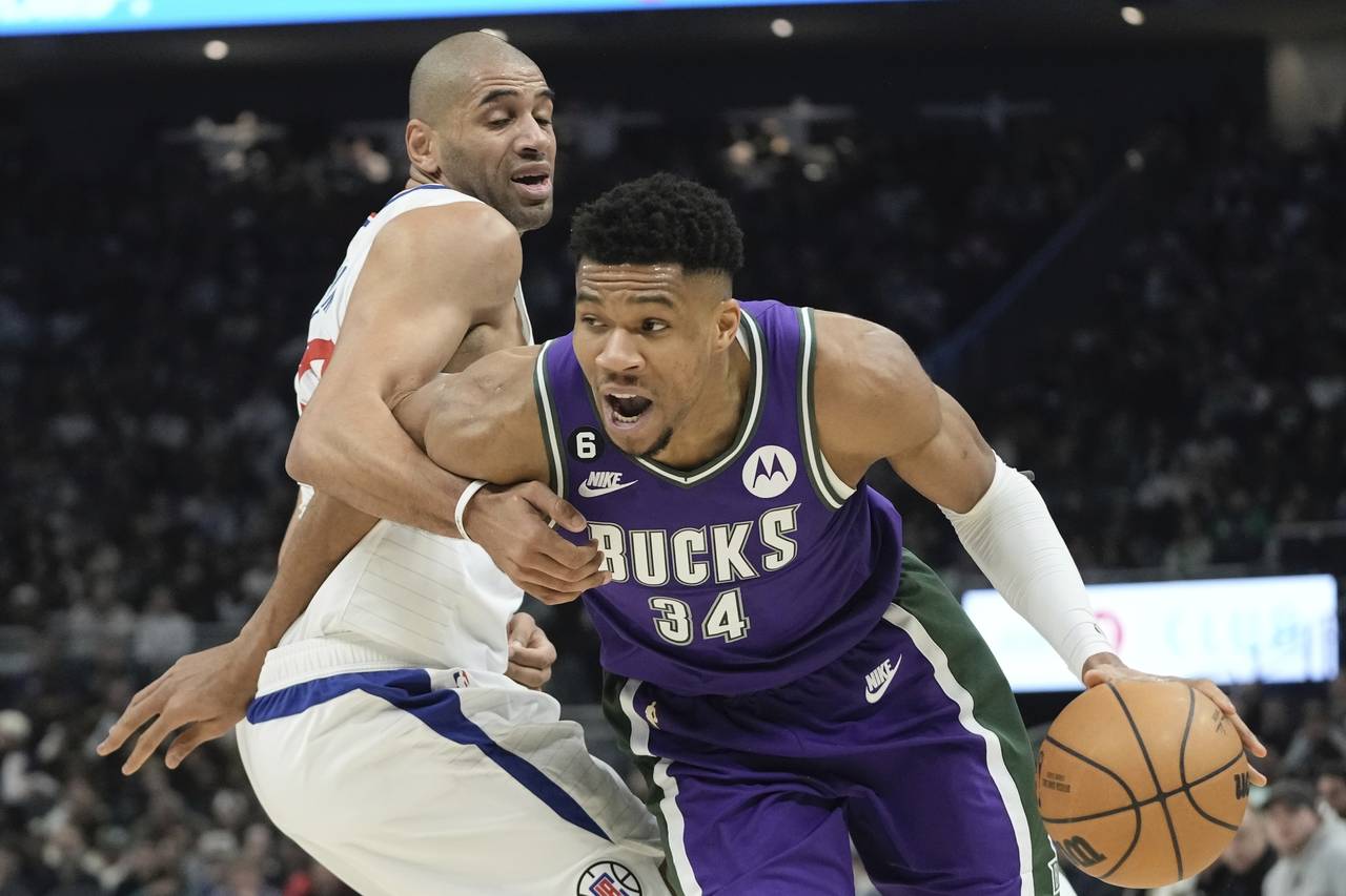 Los Angeles Clippers' Nicolas Batum fouls Milwaukee Bucks' Giannis Antetokounmpo during the first h...