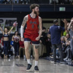 
              Saint Mary's guard Logan Johnson (0) chants during the second half of the team's NCAA college basketball game against BYU in Moraga, Calif., Saturday, Feb. 18, 2023. (Stephen Lam/San Francisco Chronicle via AP)
            