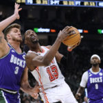 Giannis exits early with knee issue; Bucks rip Heat 128-99