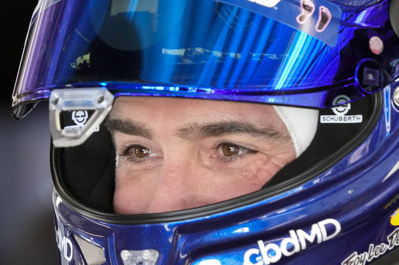 Jimmie Johnson get ready to go out on the track during a practice session for the NASCAR Daytona 50...