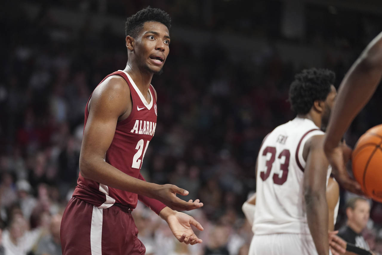 Alabama forward Brandon Miller reacts to an official's call during overtime in the team's NCAA coll...