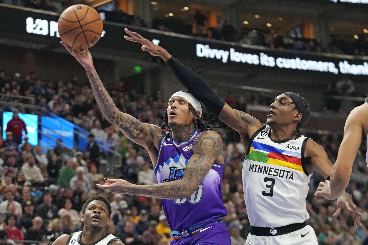 Utah Jazz guard Jordan Clarkson (00) goes to the basket as Minnesota Timberwolves forward Jaden McD...