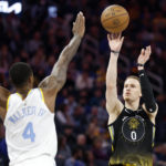 Russell shines in return to Lakers after trade by T-Wolves