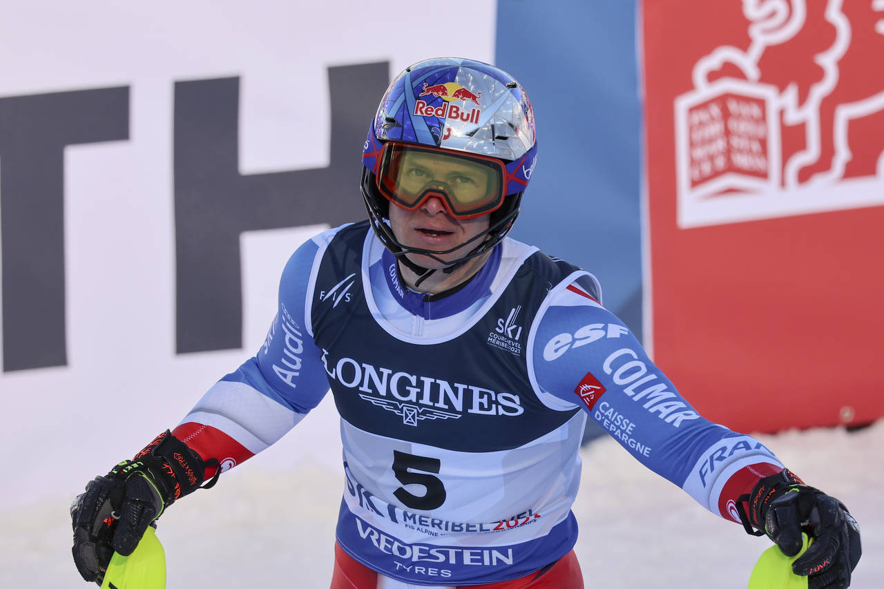 France's Alexis Pinturault checks his time after completing the slalom portion of an alpine ski, me...