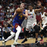 Nikola Jokic scores 27, Nuggets hold off Heat 112-108