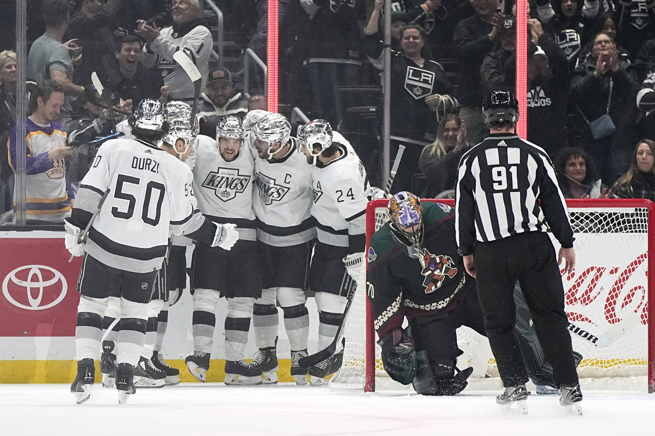 Los Angeles Kings defenseman Matt Roy (3) celebrates his goal with teammates as Arizona Coyotes goa...