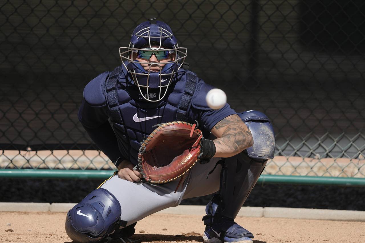 Milwaukee Brewers catcher William Contreras catches during a spring training baseball workout Thurs...
