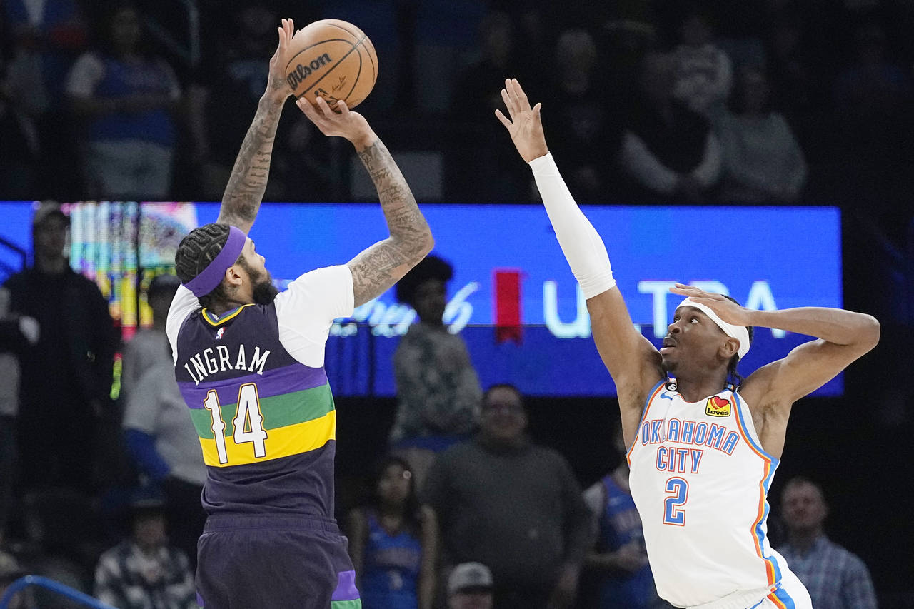 New Orleans Pelicans forward Brandon Ingram (14) shoots over Oklahoma City Thunder guard Shai Gilge...