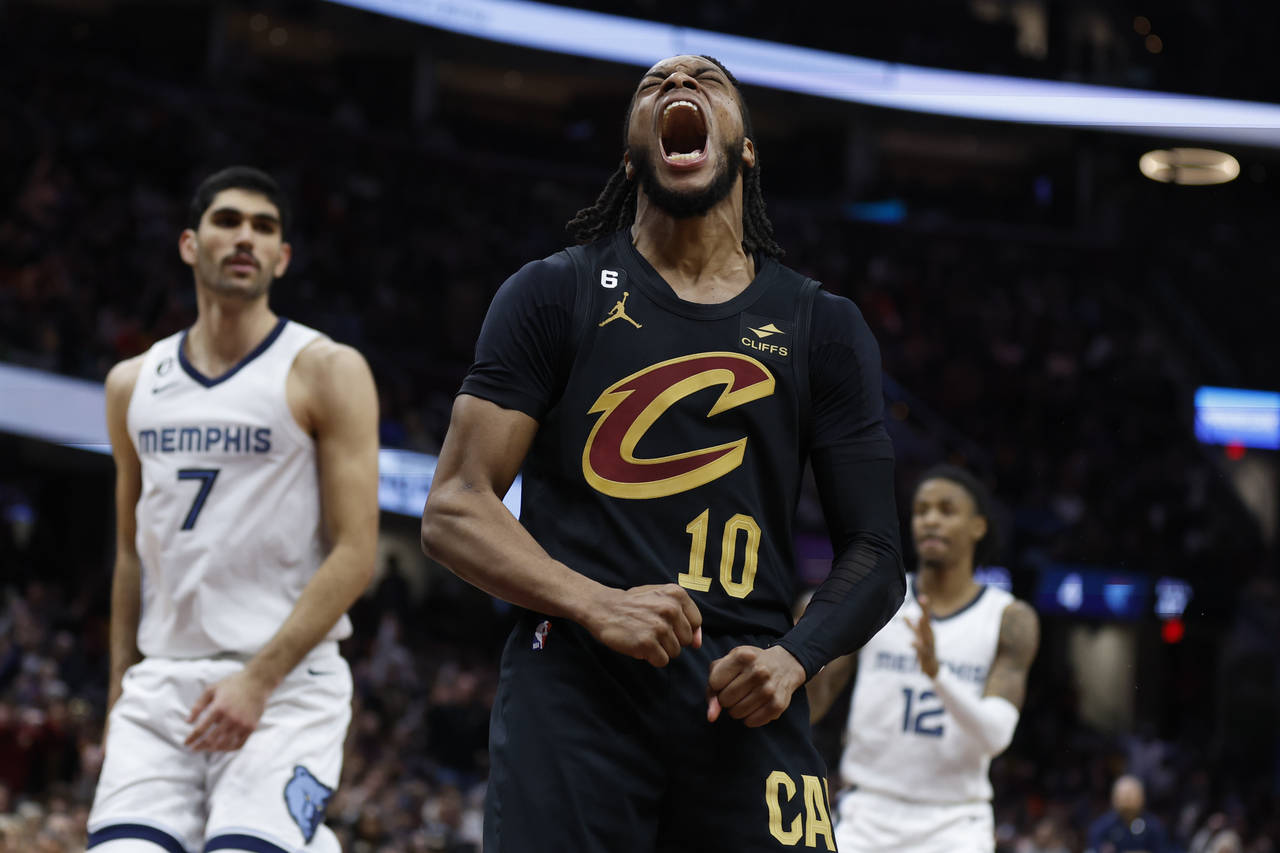 Cleveland Cavaliers guard Darius Garland (10) celebrates after scoring against the Memphis Grizzlie...