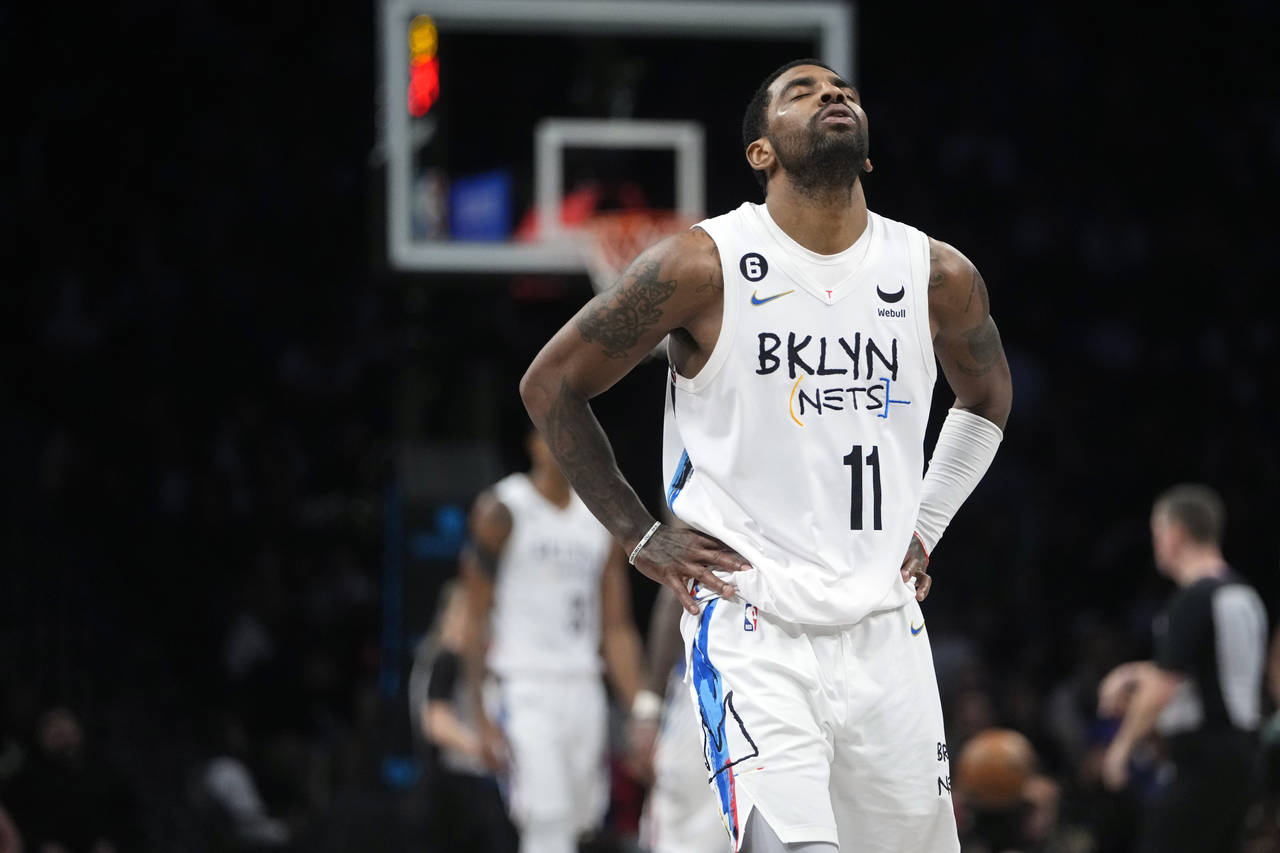 FILE -  Brooklyn Nets' Kyrie Irving reacts during the second half of the team's NBA basketball game...
