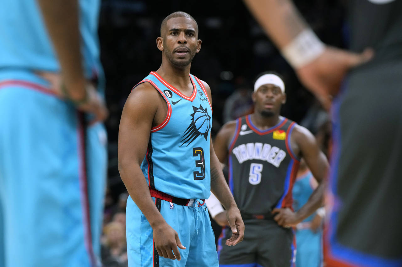 Phoenix Suns guard Chris Paul (3) stares down Oklahoma City Thunder forward Kenrich Williams during...