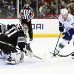 Bratt power-play OT goal gives Devils 5-4 win over Canucks