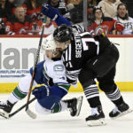 Bratt power-play OT goal gives Devils 5-4 win over Canucks