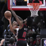 Giannis sets assists mark, hurts wrist; Bucks beat Bulls