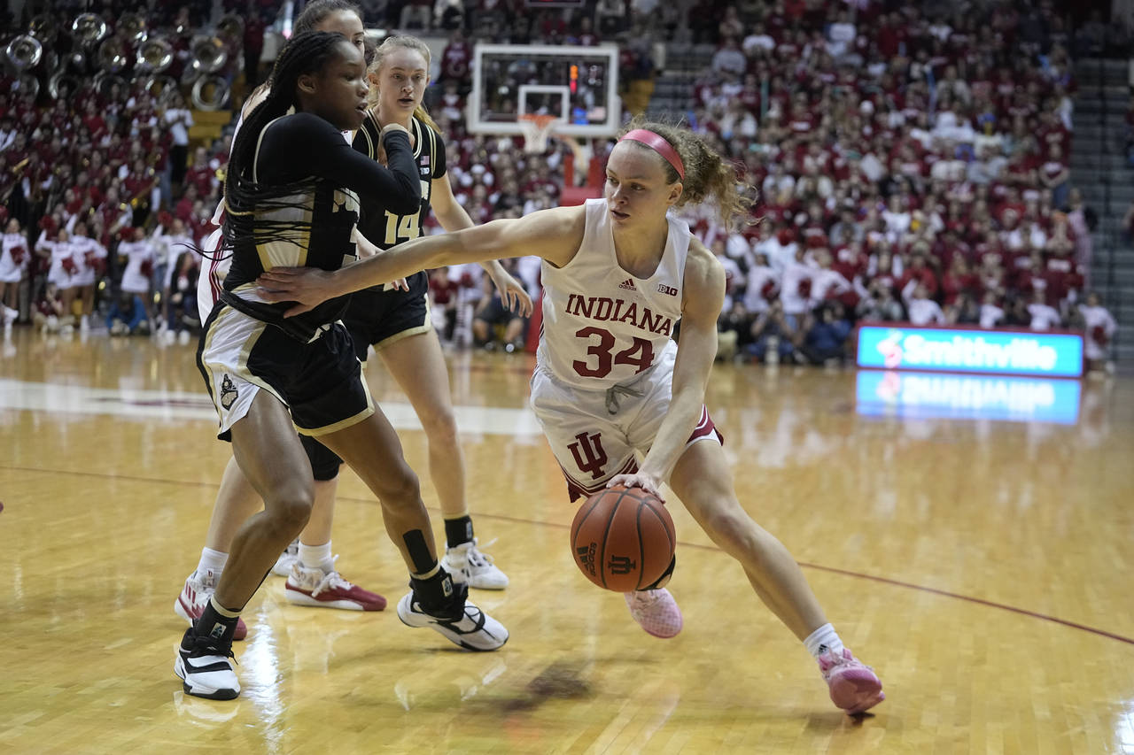Indiana's Grace Berger (34) goes to the basket against Purdue's Jayla Smith (3) during the second h...