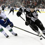Bratt power-play OT goal gives Devils 5-4 win over Canucks