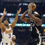 Bucks outlast Suns 104-101 for 14th consecutive victory