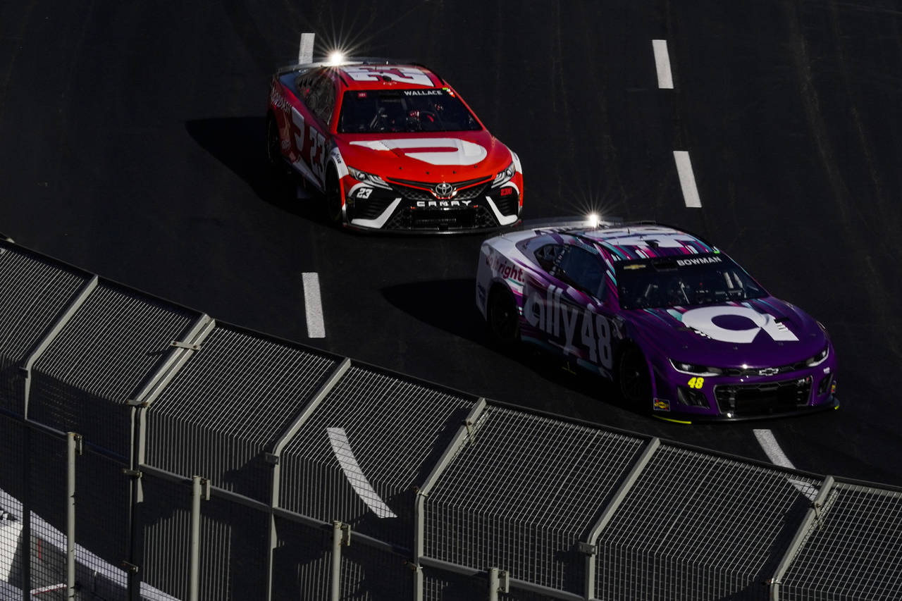 NASCAR Cup Series drivers Bubba Wallace (23) and Alex Bowman (48) participate in a practice session...