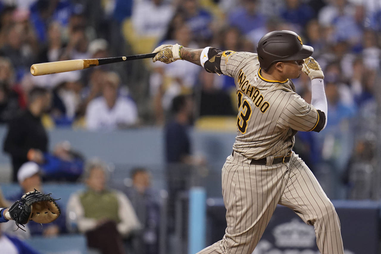 FILE - San Diego Padres' Manny Machado follows through on an RBI-double during the third inning in ...