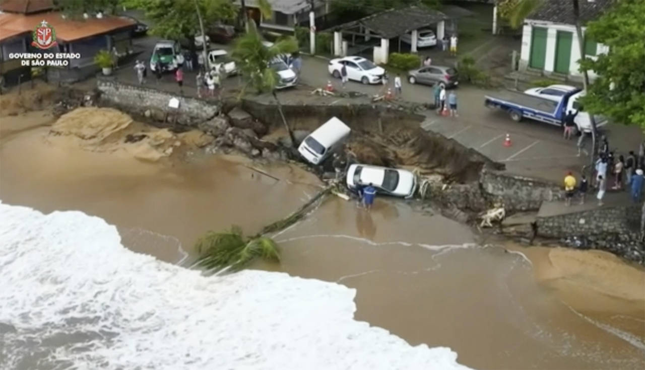 This photo provided by the Sao Paulo Government shows vehicles fallen from an elevated area along t...