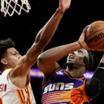 Young scores 36 as Hawks beat short-handed Suns 116-107