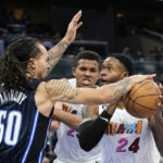 Heat use balanced scoring, rally to beat Magic 106-103 in OT